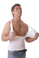 Image showing Man tearing shirt