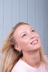 Image showing Girl in pink looking up