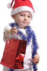 Image showing Little Santa with gifts