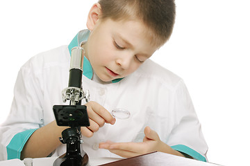 Image showing Examining with magnifier glass