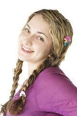 Image showing Smiling woman in lilac shirt sideview