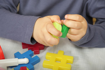 Image showing Little constructor hands