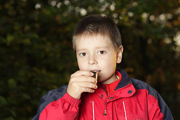 Image showing Drinking tea from thermos cup