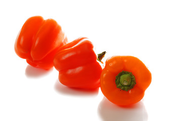 Image showing Three orange paprikas