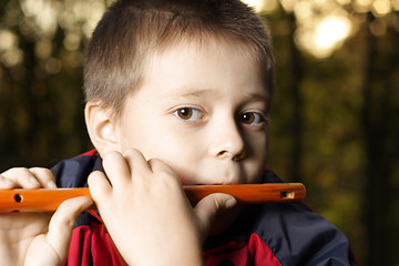 Image showing Boy playing fluite