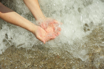 Image showing Hands in sea water