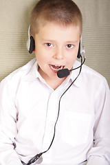 Image showing Boy talking to headset microphone