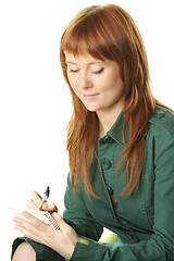 Image showing Redhead writing
