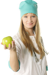 Image showing Doctor holding out apple