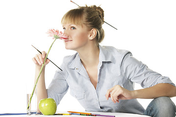 Image showing Artist smelling flower