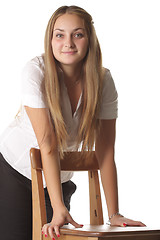 Image showing Girl leaning on chair