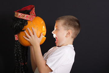 Image showing Boy and halloween pumpkin