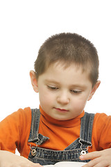 Image showing Boy in orange reading book