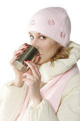 Image showing Winter woman with cup sideview