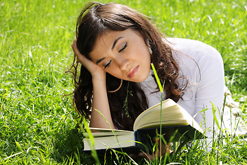 Image showing Reading book on grass