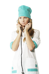 Image showing Doctor putting on stethoscope