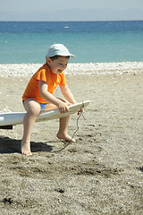 Image showing Laughing boy on wind surf