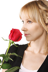 Image showing Young woman with red rose sideview