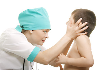 Image showing Boy at doctor with mouth open