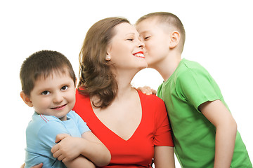 Image showing Boy kisses on mommys cheeck