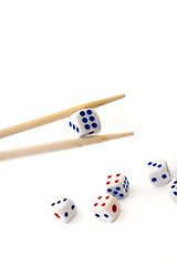 Image showing Chopsticks and dices on white background