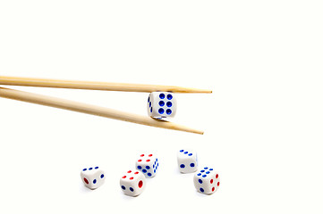 Image showing Chopsticks and dices on white background