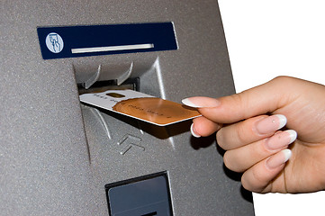Image showing Female hand inserts banking card