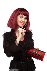 Image showing Happy woman holding credit card and wallet