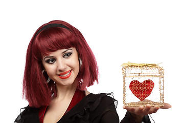 Image showing Happy woman with heart packed in a golden gift box