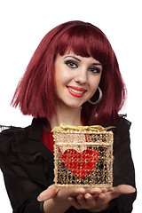 Image showing Beautiful woman with heart packed in a golden gift box