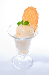 Image showing Vanilla ice cream with mint leaves and waffle