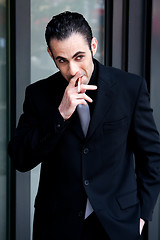 Image showing Business man smoking
