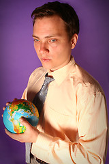 Image showing Businessman with globe in his hands