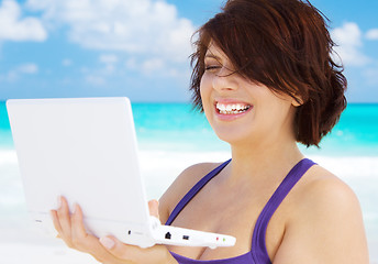 Image showing woman with laptop computer on the beach