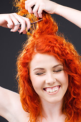 Image showing redhead with scissors