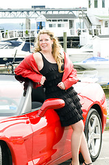 Image showing sexy woman red sports car at yacht club