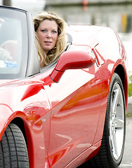 Image showing sexy woman in red sports car