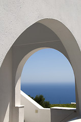 Image showing classic greek island architecture with arches and sea view