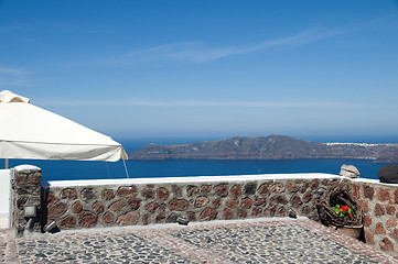 Image showing stone patio view of volcanic islands santorini greece