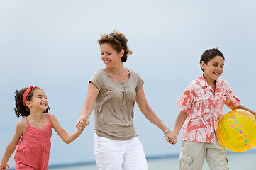 Image showing Mother and kids on the beach