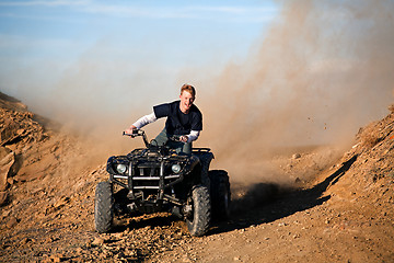 Image showing teenager riding quad four wheeler