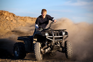 Image showing teenager riding quad