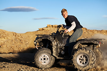 Image showing quad - teen driving four wheeler