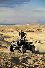 Image showing quad in hills - teen on four wheeler