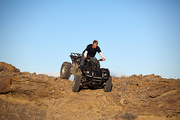 Image showing teen on ATV quad in the hills