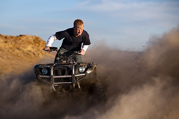 Image showing quad ATV kicking up dust