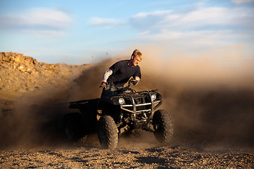 Image showing riding ATV - teen on quad