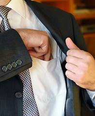 Image showing Businessman hand in inner pocket