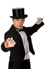 Image showing young magician performing with cards