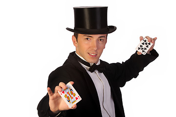 Image showing young magician performing with cards